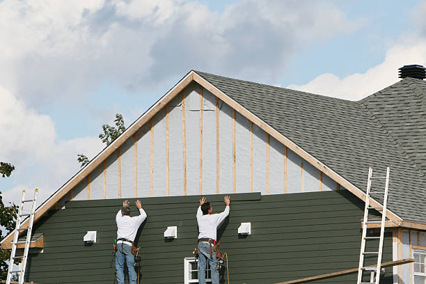 Professional Storm Damage Siding Repair technician working in New Middletown, OH
